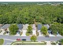 This property features a house surrounded by a lush forest, offering privacy and natural beauty at 369 Placid Lake Dr, Sanford, FL 32773