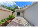 Inviting walkway leading to the home's entrance, complemented by manicured landscaping and a cozy porch at 369 Placid Lake Dr, Sanford, FL 32773