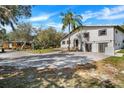 Exterior shot of house with a brick drive way and small house in the background at 40140 Swift Rd, Eustis, FL 32736