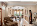 Formal dining area with modern lighting fixture and neutral colors at 600 Egret Place Dr, Winter Garden, FL 34787