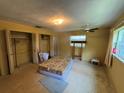 Spacious bedroom featuring a ceiling fan, closet and plenty of natural light at 1730 Oneco Ave, Winter Park, FL 32789