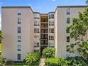 Well-maintained condo building with a center walkway and lush greenery creating a peaceful atmosphere at 204 Quayside Cir # 601, Maitland, FL 32751