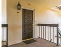 View of a unit front door with a welcome mat and exterior lighting at 204 Quayside Cir # 601, Maitland, FL 32751