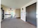 Clean condo hallway featuring carpet, an elevator, and well-lit access to each unit at 204 Quayside Cir # 601, Maitland, FL 32751