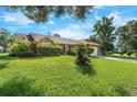 Charming single-story home with well-maintained landscaping, lush lawn and a two car garage at 2809 Gulf Winds Ct, Oviedo, FL 32765