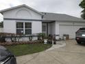 Charming one-story home with a well-manicured lawn and a two-car garage at 362 White Marsh Cir, Orlando, FL 32824