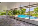 Enjoy the view from the covered and screened lanai overlooking the backyard swimming pool at 403 Broadview Ave, Altamonte Springs, FL 32701