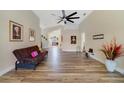 Bright living room boasts wood flooring, neutral walls, and plenty of space to relax and entertain at 4533 Oakbrook Ct, Kissimmee, FL 34746