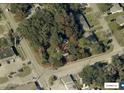 Aerial view of a large, wooded lot surrounded by streets, with a red boundary line marking the property at 578 3Rd St, Daytona Beach, FL 32117