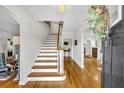 Bright foyer showcasing a staircase with hardwood treads and open access to other living spaces at 624 Richmond Street, Orlando, FL 32806