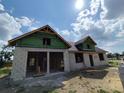 Exterior block construction showing zip system, roof and window openings during the building process at 9659 Midway Rd, Haines City, FL 33844