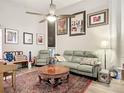 Cozy living room with comfortable seating, stylish decor, and ample natural light at 219 E Fern Dr, Orange City, FL 32763