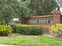 Welcoming brick sign marking the entrance to the Morgan Point community at 2421 Queenswood Cir, Kissimmee, FL 34743