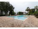 Inviting community pool area featuring clear water and comfortable lounge areas for relaxation and socializing at 2525 Maitland Crossing Way # 202, Orlando, FL 32810