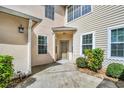 The welcoming entrance shows a front door with well-maintained landscaping at 3030 Clubview Dr # Ge, Orlando, FL 32822