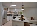 Modern kitchen with stainless steel appliances and sleek countertops at 3176 Feltrim Pl # 302, Kissimmee, FL 34747