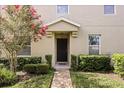 Charming townhome entrance with manicured landscaping and a welcoming front door at 3537 Seneca Club Loop # B, Orlando, FL 32808