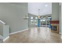 Bright living room boasts soaring ceilings, fireplace, and sliding doors leading to an outdoor patio at 3966 Villas Green, Longwood, FL 32779