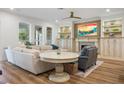 Elegant living room featuring a fireplace, custom built-ins, and stylish, comfortable seating at 6047 Blakeford Dr, Windermere, FL 34786