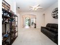 Bright, open-concept living area with neutral carpet, archways, and ample natural light at 636 Cheviot Ct, Apopka, FL 32712