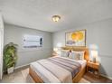 Cozy bedroom featuring a comfortable bed, warm lighting, and elegant decor at 7040 Hennepin Blvd, Orlando, FL 32818