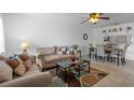 Cozy living room and dining area offering an open floor plan and plenty of natural light at 8116 Parrot Dr, Orlando, FL 32825