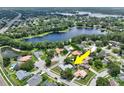 Aerial view of home with expansive lake view at 8248 Marbella View Ct, Orlando, FL 32817