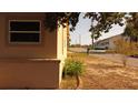 A street view of property showing adjacent house and greenery at 1020 E Main St, Haines City, FL 33844