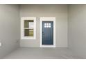 Covered porch featuring a modern door and window, perfect for enjoying the outdoors at 14905 Sw 39Th Cir, Ocala, FL 34473