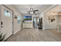 Open concept living room with luxury vinyl plank flooring and modern decor at 1615 W Gadsen Blvd, Orlando, FL 32812
