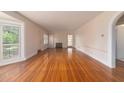 Bright living room featuring hardwood floors, fireplace, and white trim at 1621 Sunnyside Dr, Maitland, FL 32751