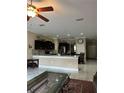 Well-lit kitchen with dark cabinetry and a breakfast bar at 1637 Mistflower Ln, Winter Garden, FL 34787