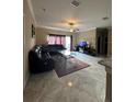 Spacious living room with tile flooring and a comfortable sectional sofa at 1637 Mistflower Ln, Winter Garden, FL 34787