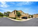 Inviting exterior of townhomes with well-maintained landscaping and private garages at 2011 Crestdale Ln, Lake Mary, FL 32746
