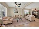 Inviting living room with neutral color palette, tile floors, ample seating, and plenty of natural light at 2319 Dammar St, Orlando, FL 32824