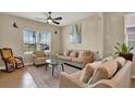 Comfortable living room with neutral tones, plush seating, large windows, and an open, airy feel at 2319 Dammar St, Orlando, FL 32824
