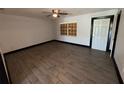 An empty bedroom featuring tile floors, a ceiling fan, and natural light at 4534 Lemans Dr, Orlando, FL 32808