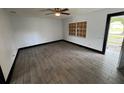 An empty bedroom featuring tile floors, a ceiling fan, and natural light at 4534 Lemans Dr, Orlando, FL 32808