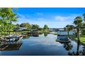 Picturesque waterfront view with multiple boat docks and serene water reflections at 65 Oakdale St, Windermere, FL 34786