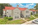 Multi-Gathering building with red tile roof and well-kept landscaping, offering a classic and inviting curb appeal at 900 Northern Dancer Way # 204, Casselberry, FL 32707