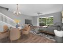 Bright living room featuring a modern fireplace, hardwood floors, and access to outdoor patio at 976 Rock Harbor Ave, Orlando, FL 32828