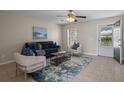 Comfortable living room with stylish furniture, tile flooring, and natural light creating a welcoming atmosphere at 110 Rabun Ct, Sanford, FL 32773