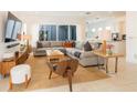 Comfortable living room with a large sectional sofa, natural light, and stylish decor at 1545 Fairview Cir, Reunion, FL 34747
