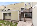 Charming condo showcasing a private entrance with wooden stairs and a cozy atmosphere at 208 Scottsdale Sq # 208, Winter Park, FL 32792