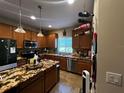 Well-equipped kitchen showcasing ample cabinet space and modern appliances at 2564 River Landing Dr, Sanford, FL 32771