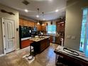 Spacious kitchen with stainless steel appliances, granite countertops, and a functional island at 2564 River Landing Dr, Sanford, FL 32771