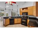 Modern kitchen featuring sleek cabinetry, granite countertops, and stainless steel appliances at 3713 Ocita Dr, Orlando, FL 32837