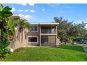 Condo featuring a private balcony and screened patio, perfect for outdoor living at 6120 Peregrine Ave # A08-2, Orlando, FL 32819