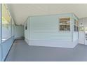 Covered patio provides ample space for outdoor relaxation and entertainment at 945 Shawna Shrs, Haines City, FL 33844