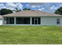 A large screened-in back porch overlooks a huge lawn at 109 Belgian Way, Sanford, FL 32773